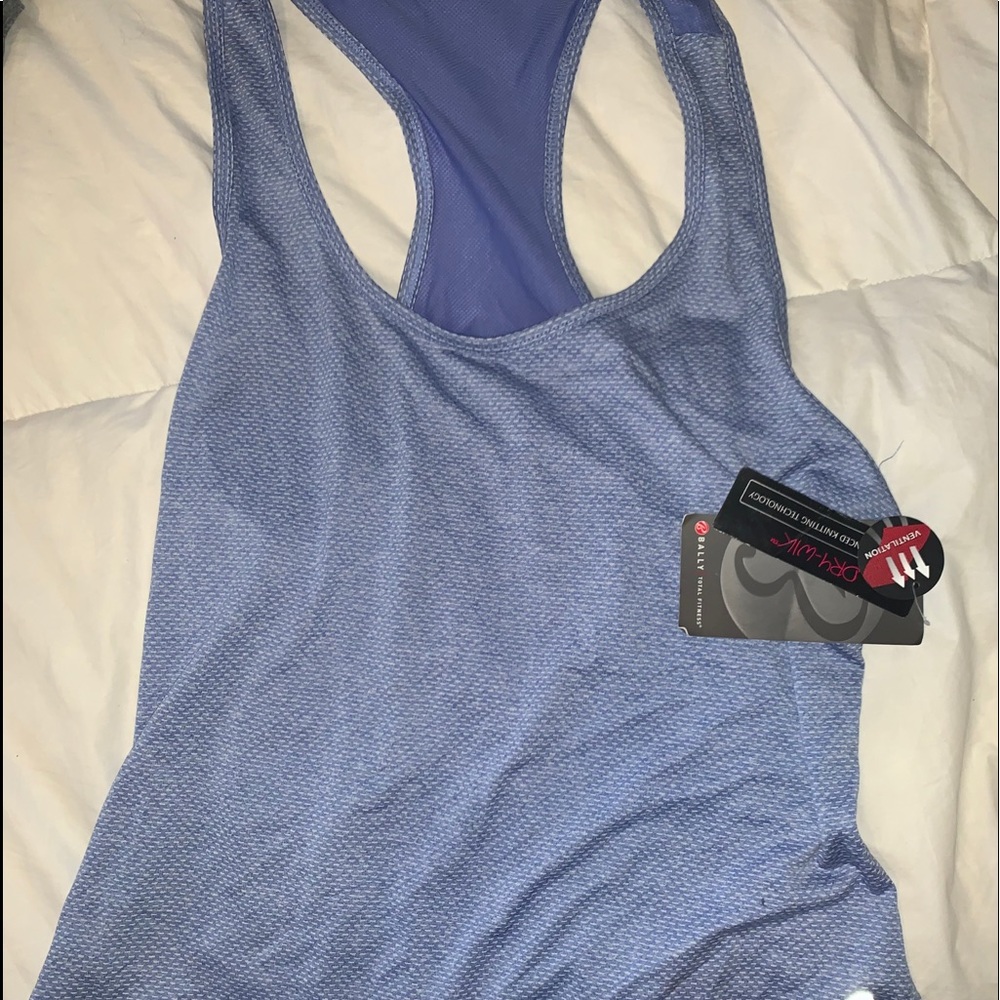 2 women’s work out tanks new with tags!